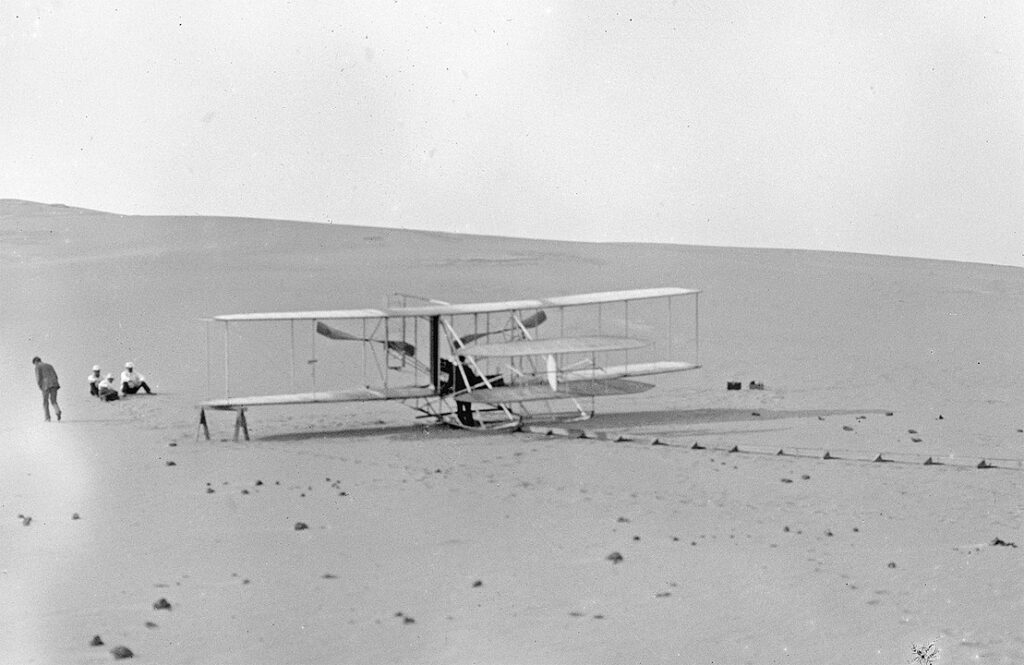 The modified 1905 Flyer at the Kill Devil Hills in 1908, ready for practice flights. Note there is no catapult derrick; all takeoffs were used with the monorail alone